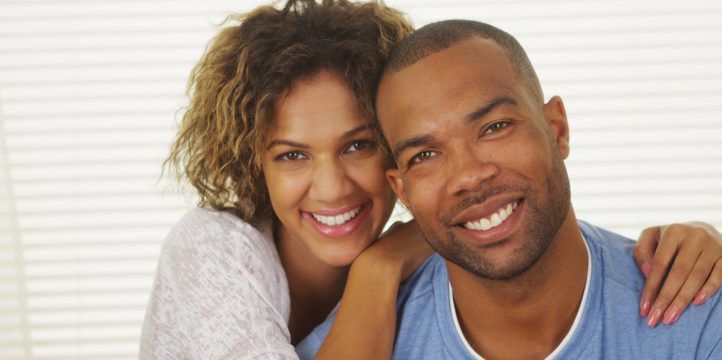 Happy Black couple smiling